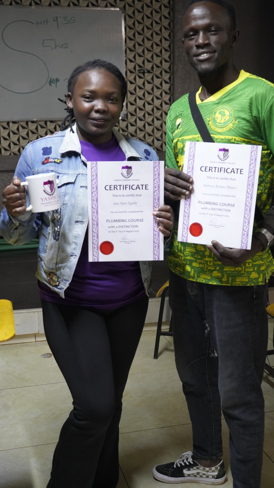 Students receiving certificates after completing their courses